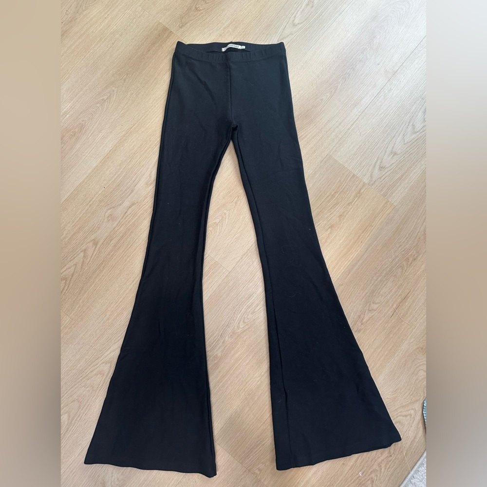 Black Novella Royale high-waisted flare pants. Janis Bells.
